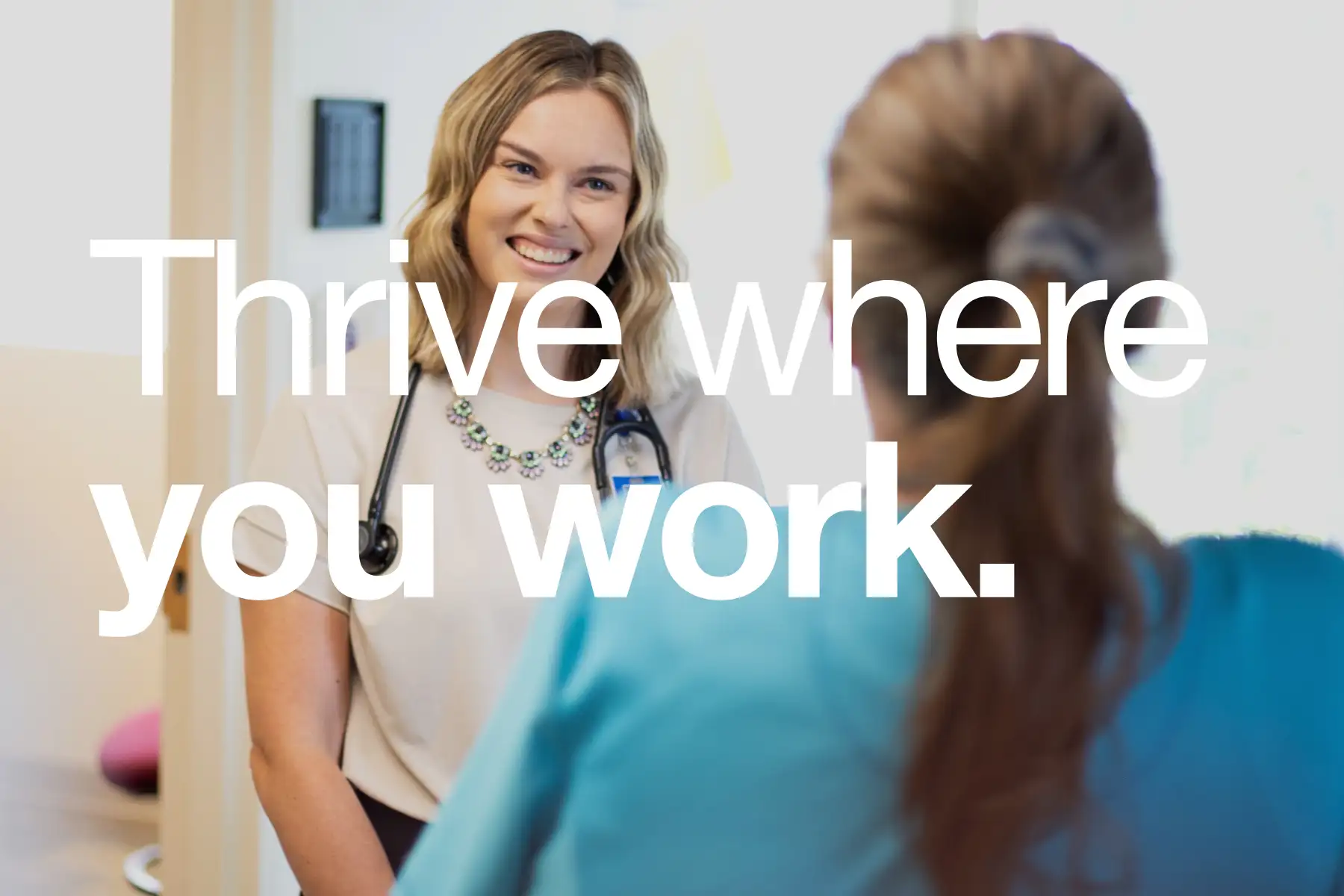 Image of St. Luke's provider with patient, with overlay of "Thrive where you work."